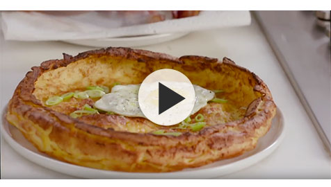 Savory Dutch Baby with Eggs and Bacon >