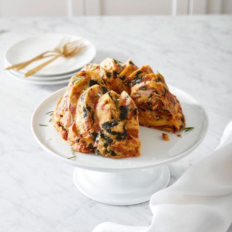 Croissant On Baking Sheet In Stainless Steel Oven Stock Photo