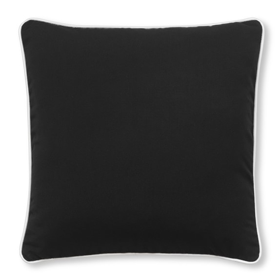 black outdoor cushions with white piping