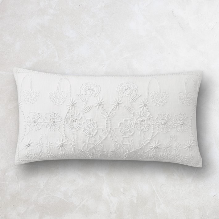 white embroidered cushion covers