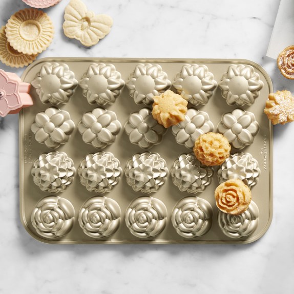 https://assets.wsimgs.com/wsimgs/ab/images/dp/wcm/202326/0005/nordic-ware-cast-aluminum-nonstick-flower-petits-fours-pan-c.jpg