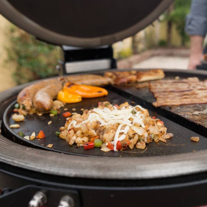 https://assets.wsimgs.com/wsimgs/ab/images/dp/wcm/202339/0015/kamado-joe-half-moon-cast-iron-reversible-grill-griddle-o.jpg