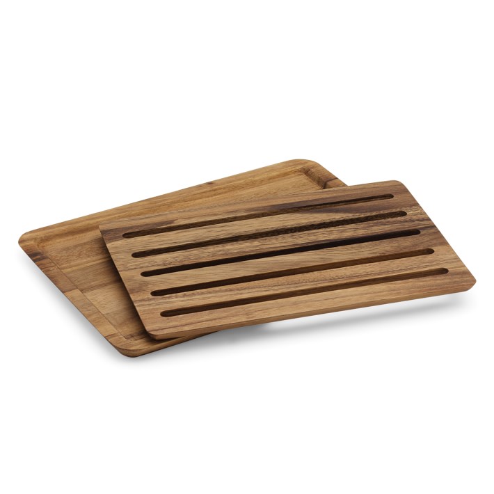 Cutting board for bread with removable crumb tray.