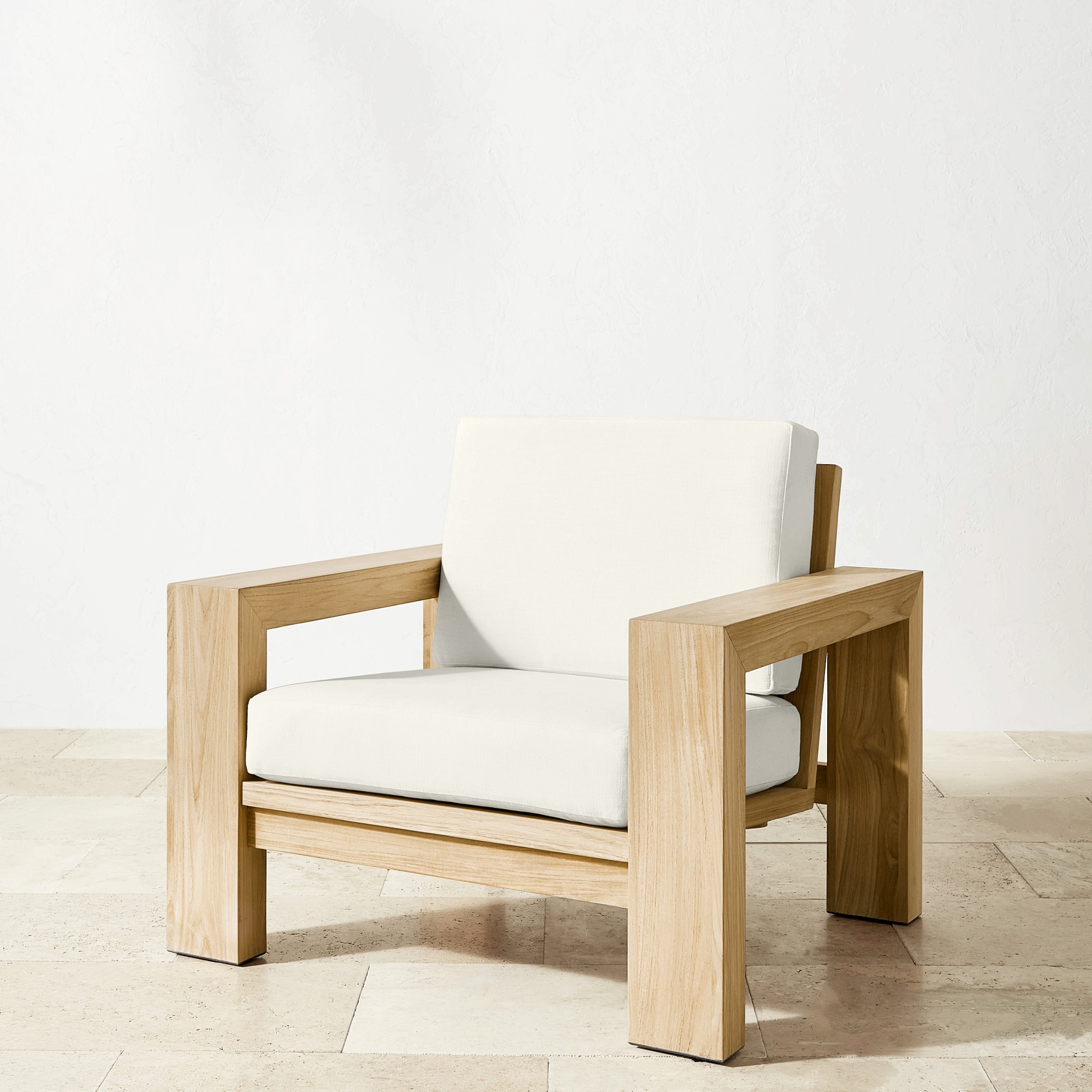 Close-up of white cushion and wooden frame with visible stitching