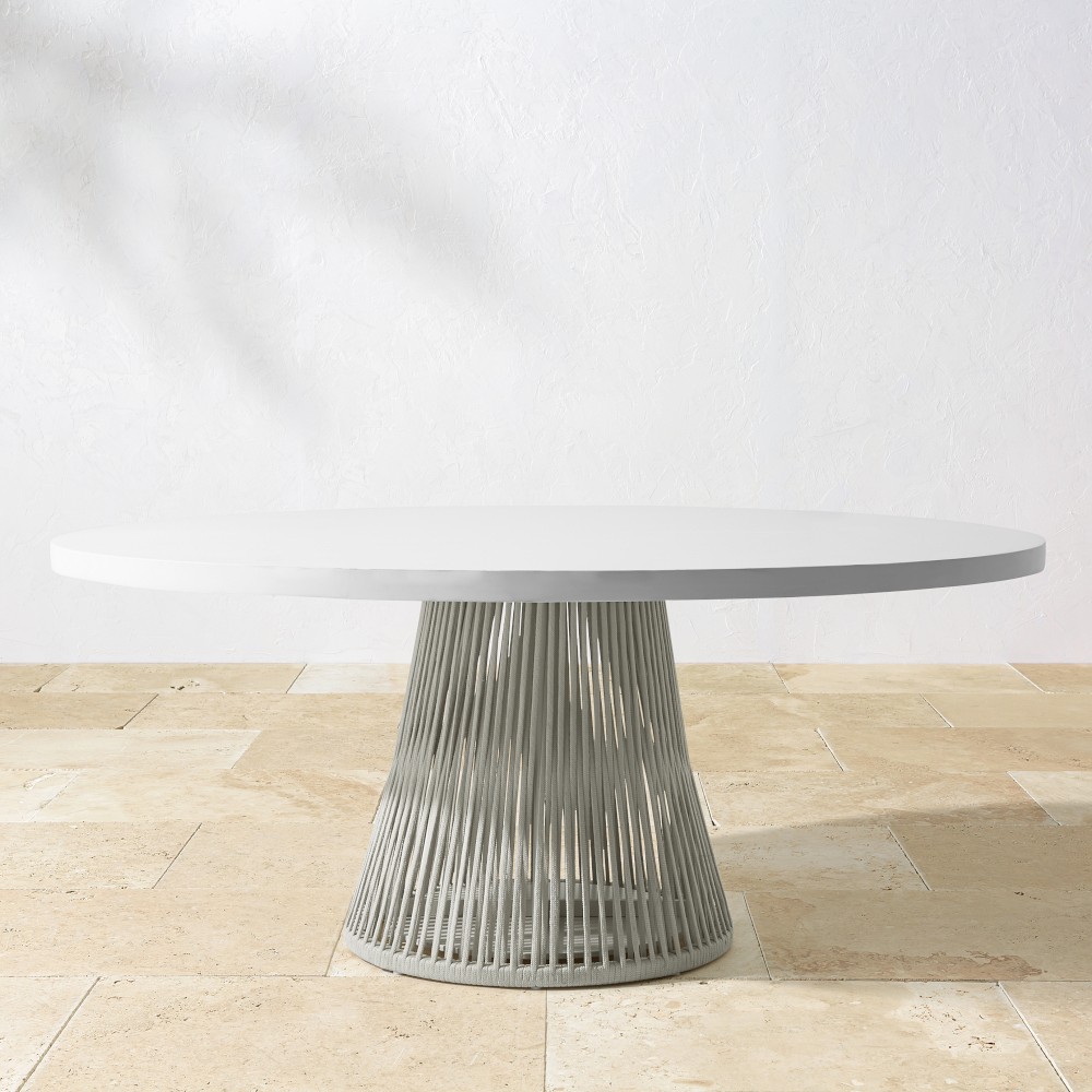 Close-up of the white oval tabletop and ribbed pedestal base