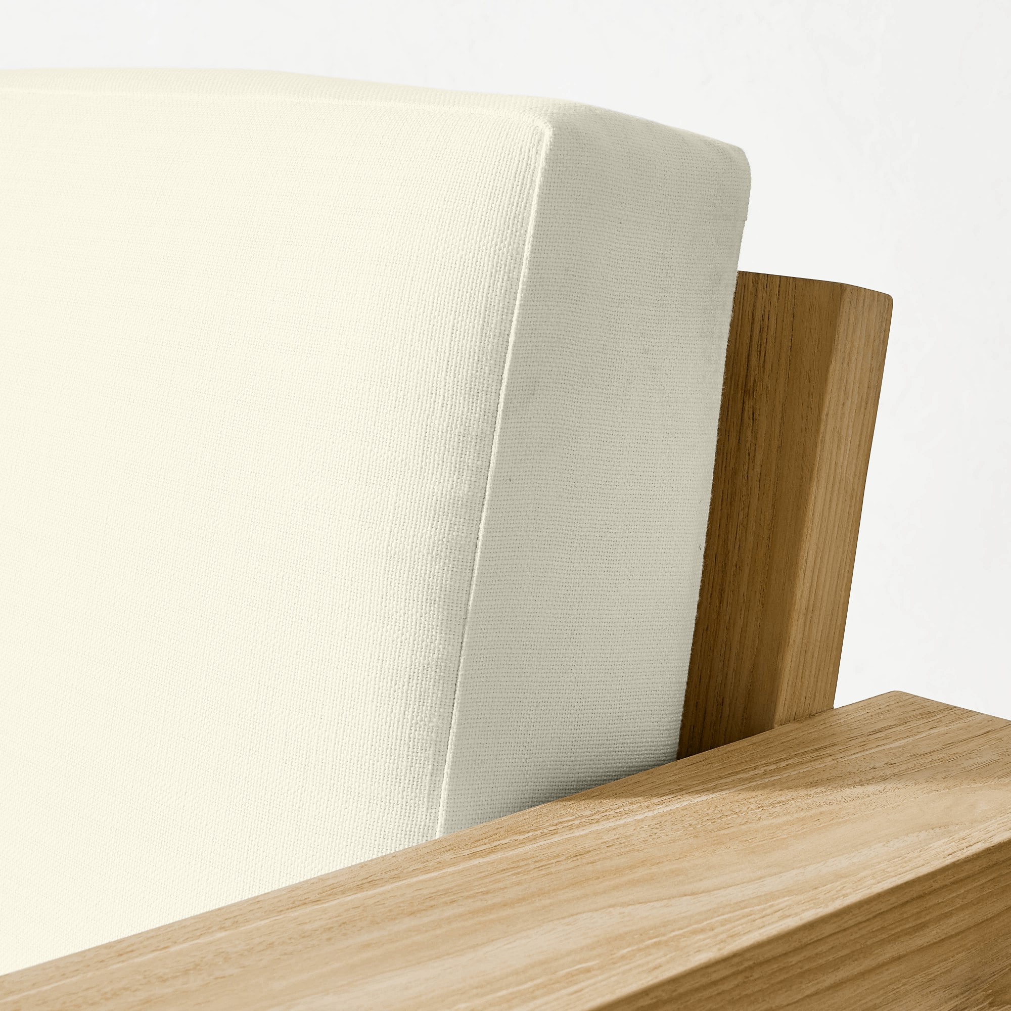 Corner of wooden armrest and cushion connection detail