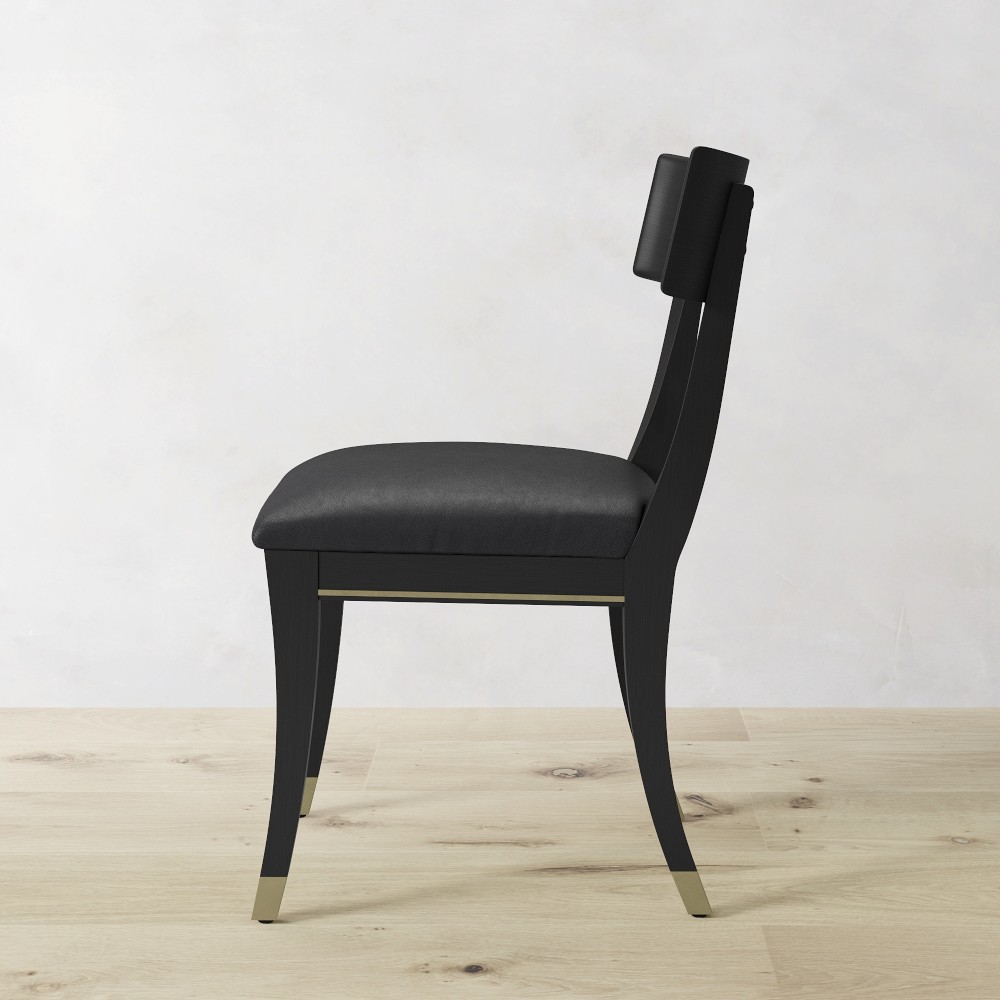 Side profile of Klismos chair with brass tipped feet