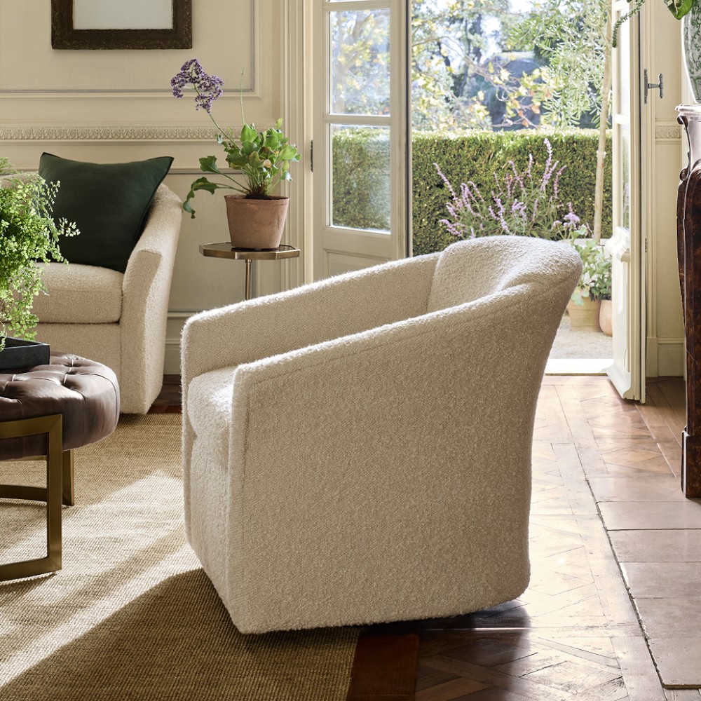 Beige textured swivel chair from side angle
