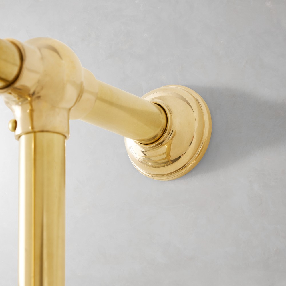 Close-up of wall mount bracket in brass finish
