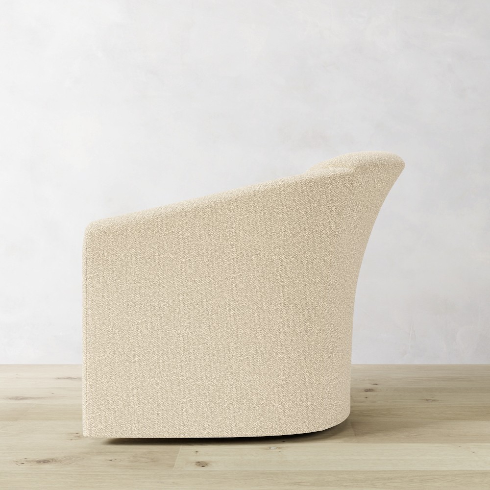 Beige rounded armchair side profile