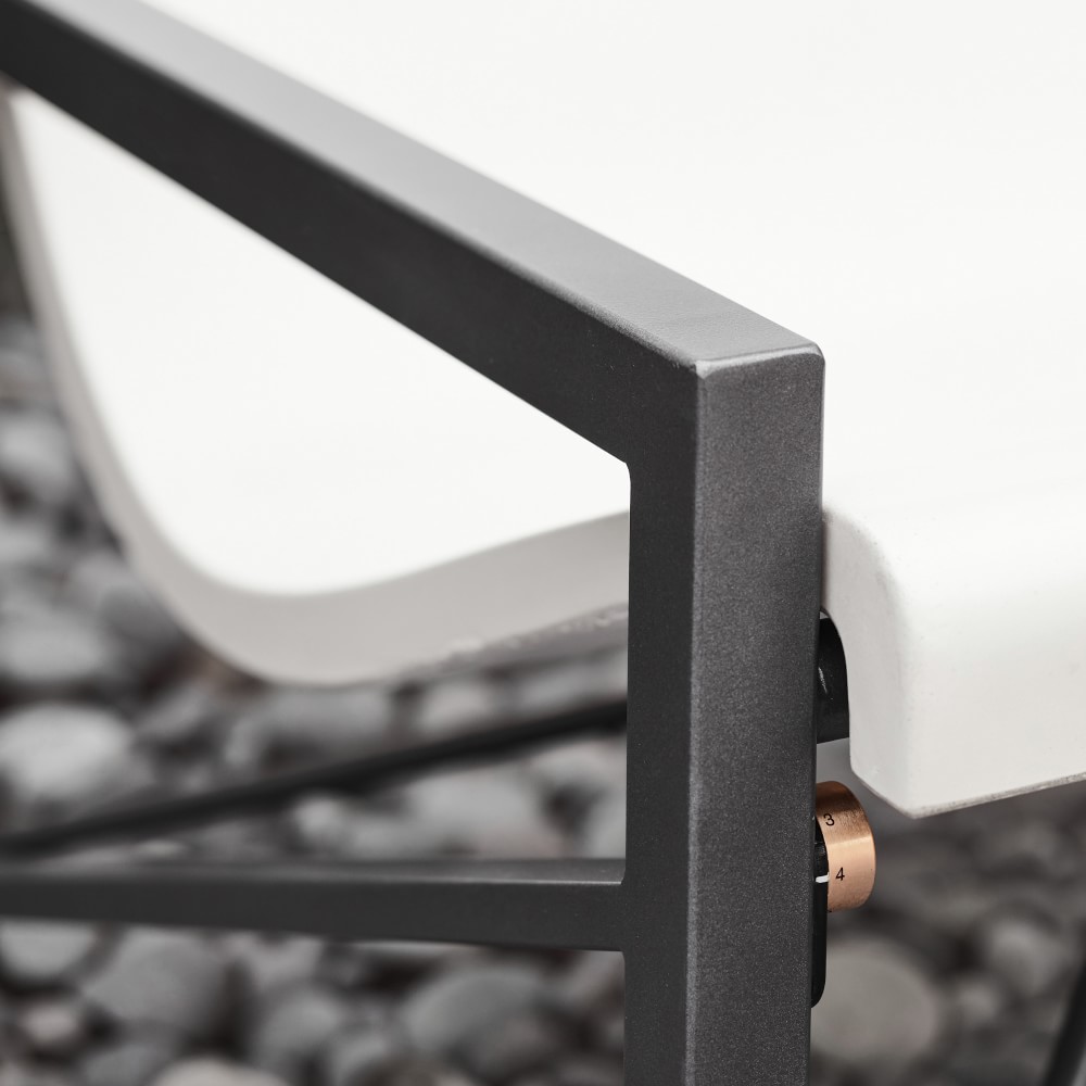 Close-up of the sofa arm and metal frame with visible hardware