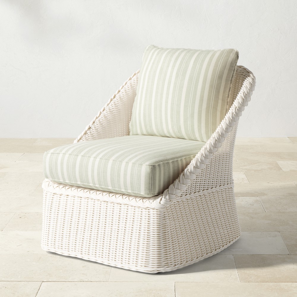 Front view of white wicker chair with striped seat cushion