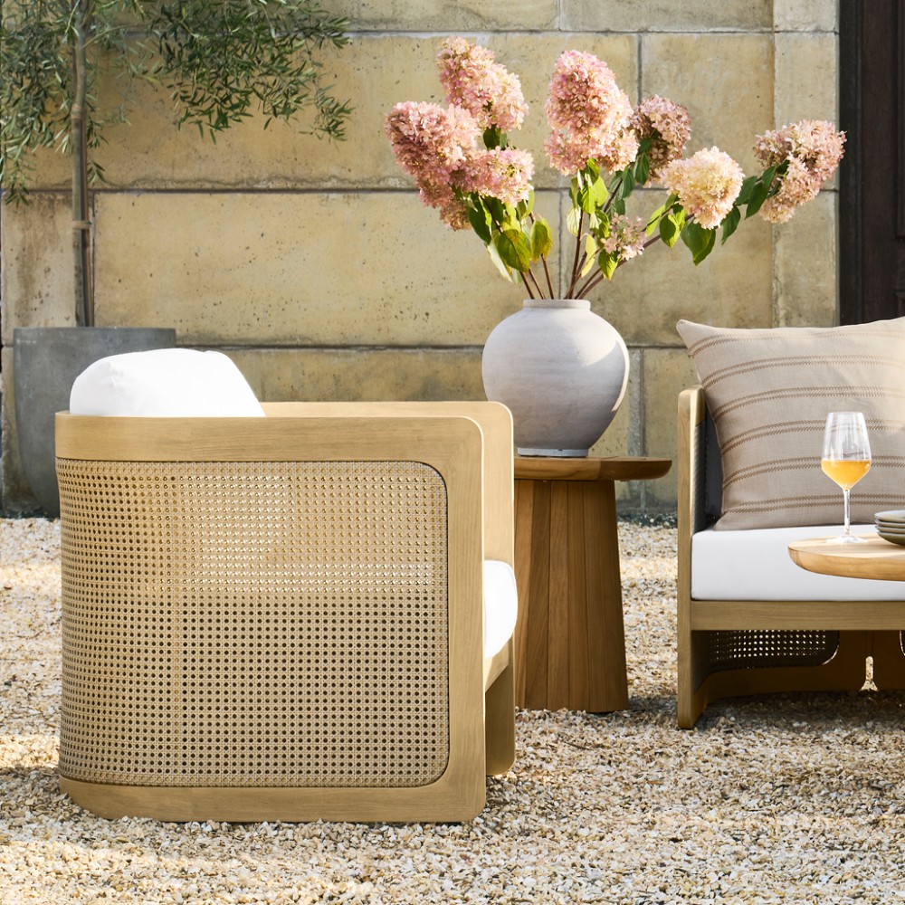 Outdoor seating arrangement with vase and drinks