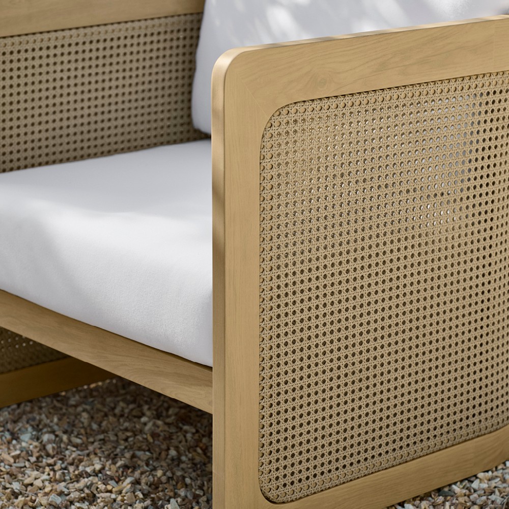 Close-up of woven cane panel on outdoor armchair