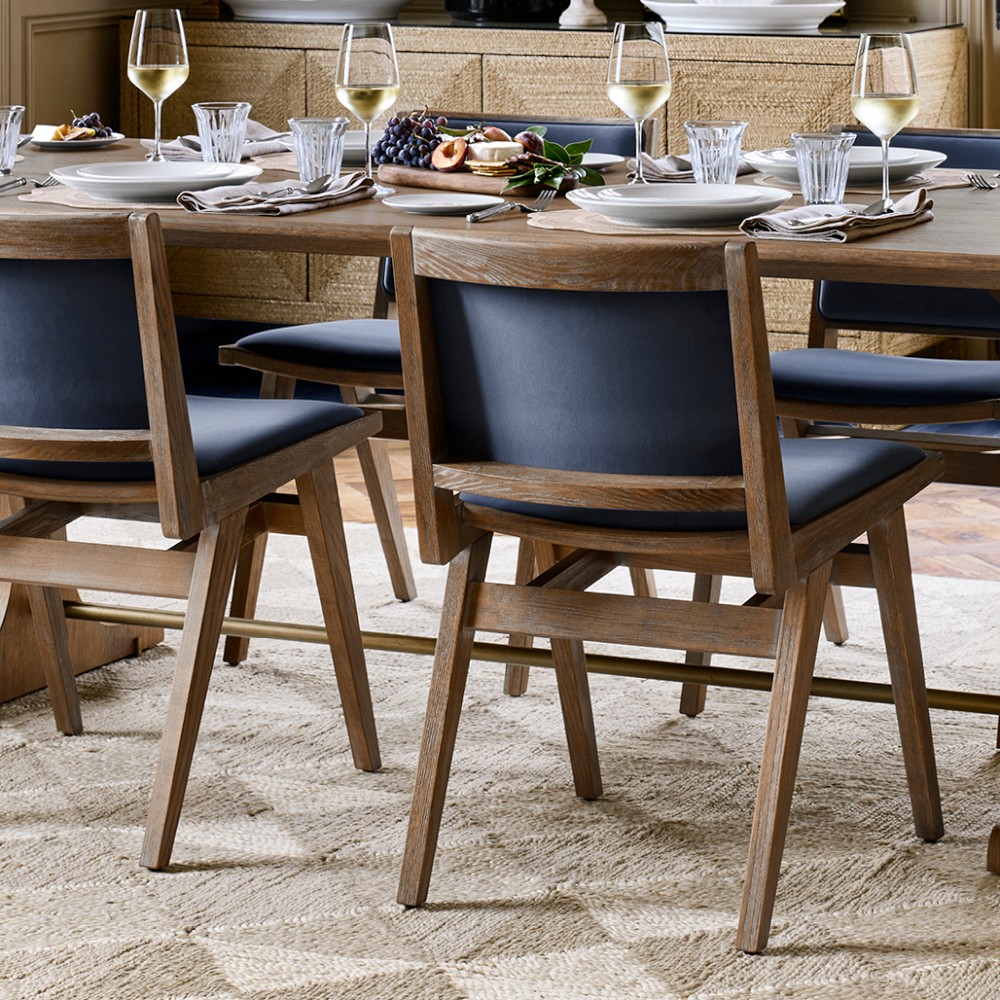Set of Solara upholstered dining chairs around a wooden dining table