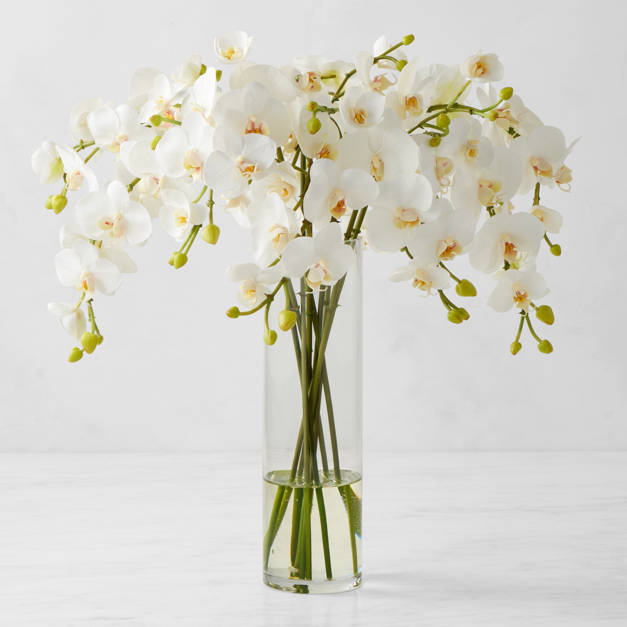 Faux Orchid Arrangement in Slim Vase Simolary simolary.com