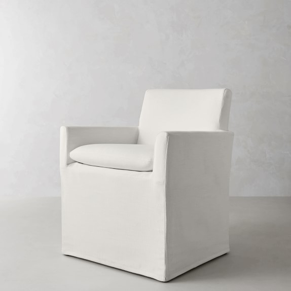 white slipcovered dining armchair