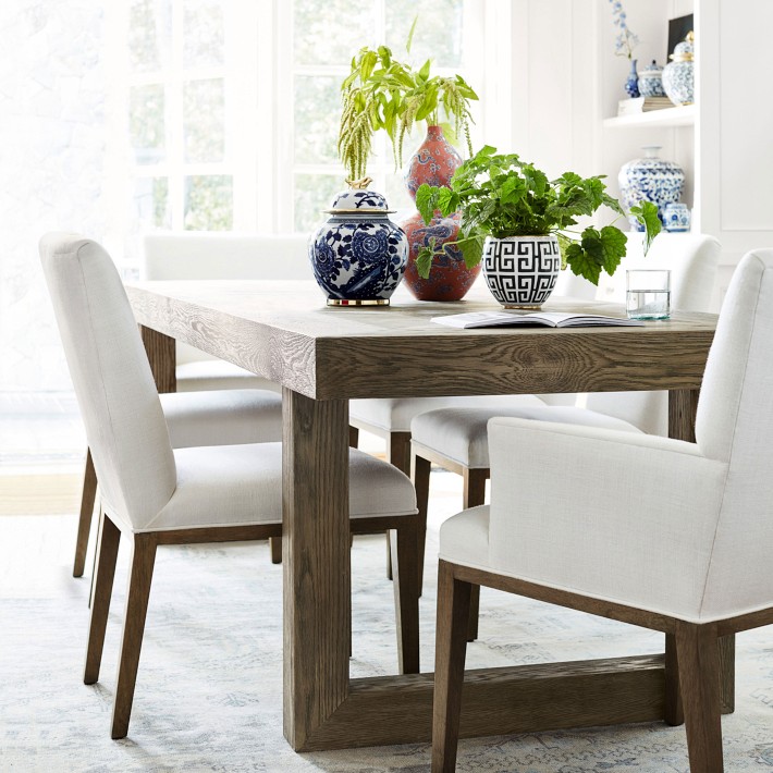 white cloth dining room chairs