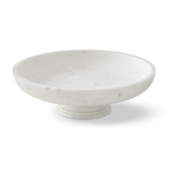 white ceramic pedestal fruit bowl