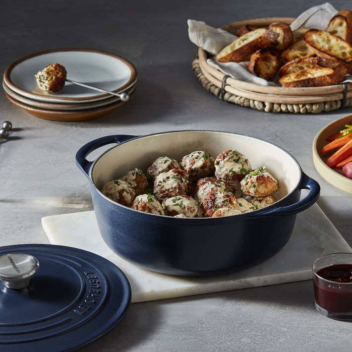https://assets.wsimgs.com/wsimgs/rk/images/dp/wcm/202325/0051/le-creuset-enameled-cast-iron-shallow-round-oven-2-3-4-qt-o.jpg