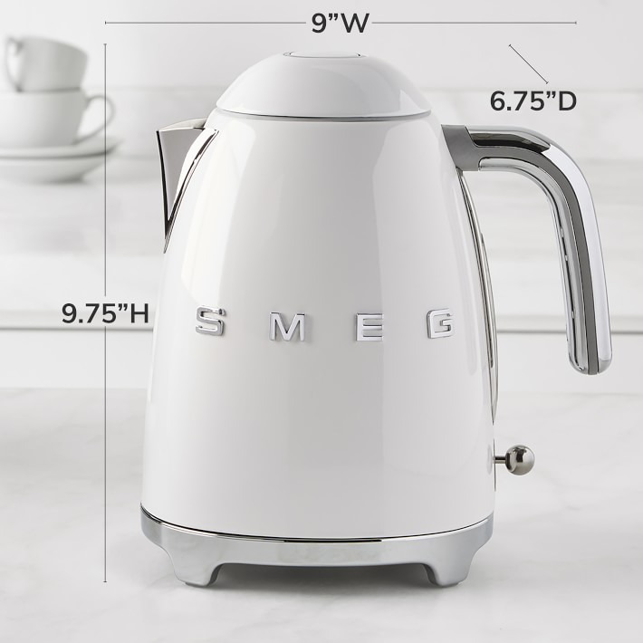 Green electric kettle SMEG for boiling water and making tea or coffee on  table in hotel as design element. Household kitchen appliances for makes  hot drinks. Moscow - July, 2022. Stock Photo