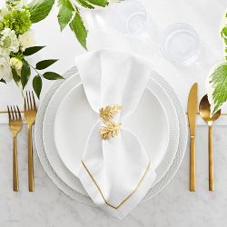 Gold Plates & Utensils on a Simple White Linen Table