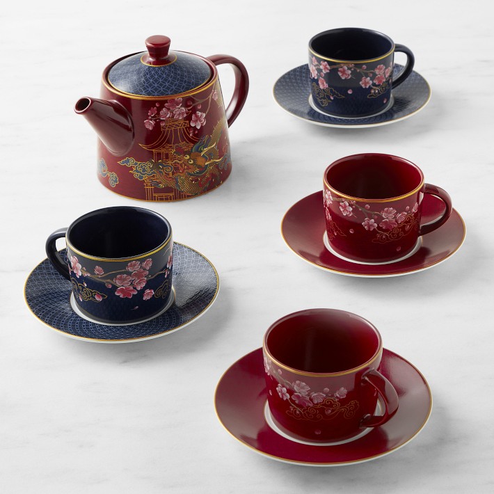 red and blue tea set with images of pink cherry blossoms