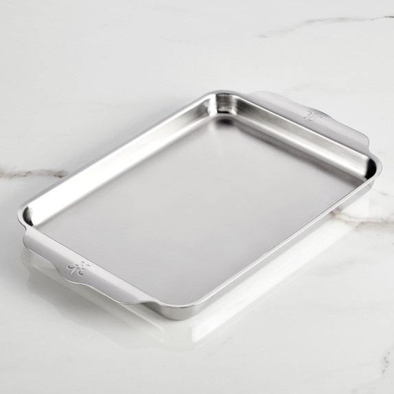 Empty rectangular metal pan covered with brown parchment paper and