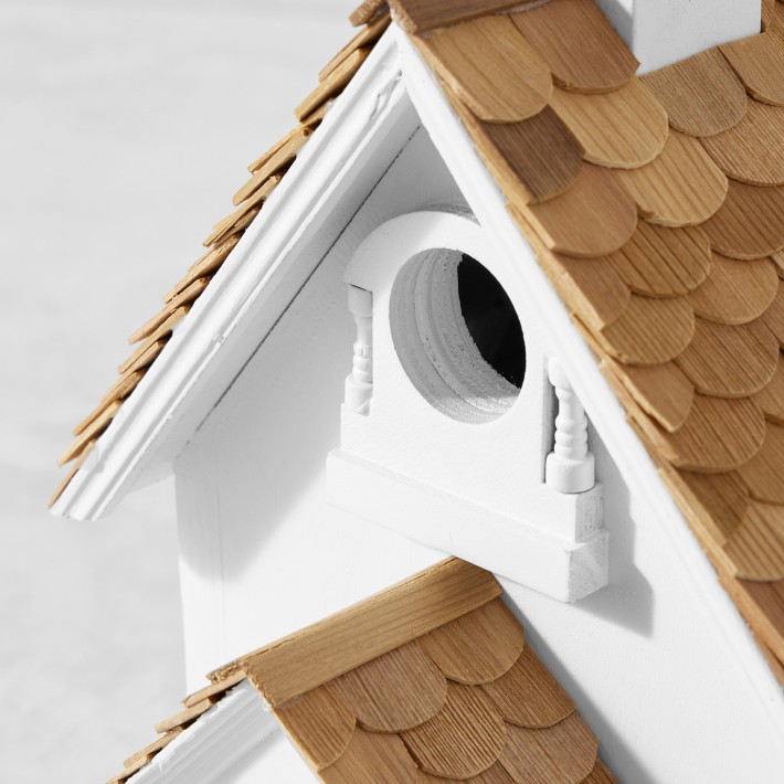 a loaf of fresh bread flour product in a bird's nest on a wooden