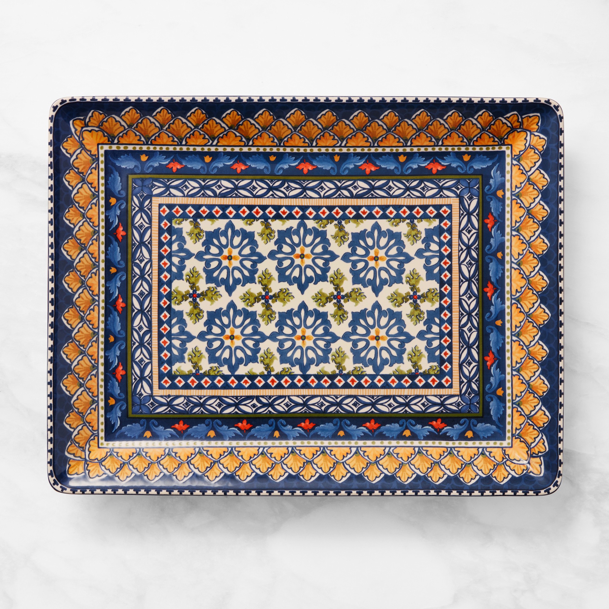 A blue and yellow patterned serving platter