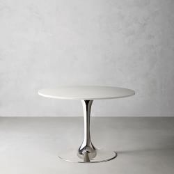 Round white tabletop with metallic chrome pedestal base against a plain backdrop.