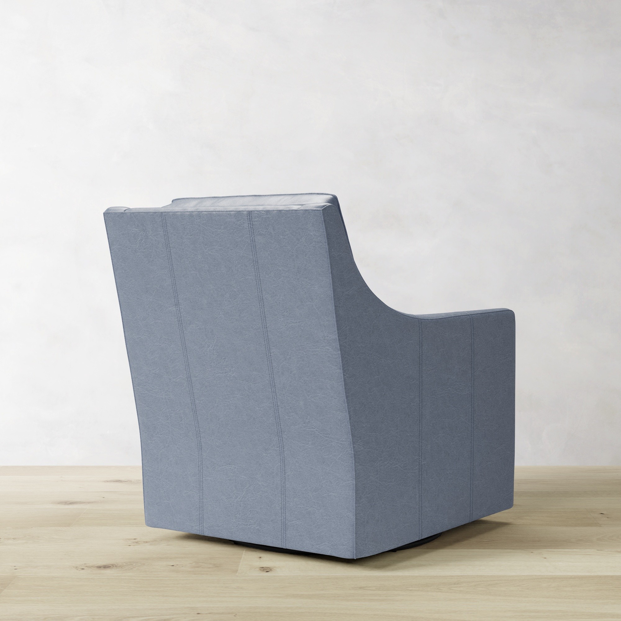 Beige fabric armchair back view showing vertical seam panels and flat top edge.