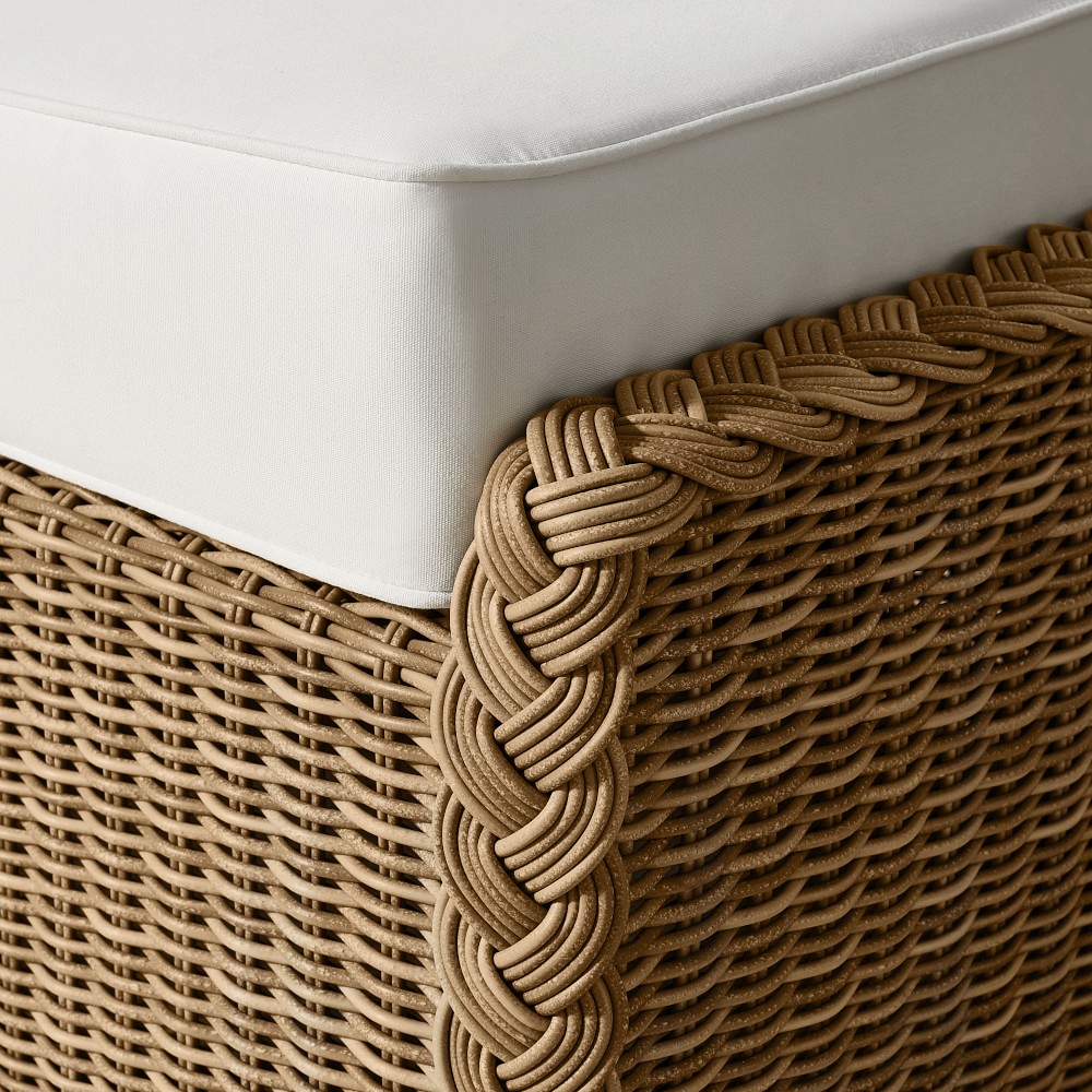 Close-up of rattan weave on the edge of an outdoor sofa cushion