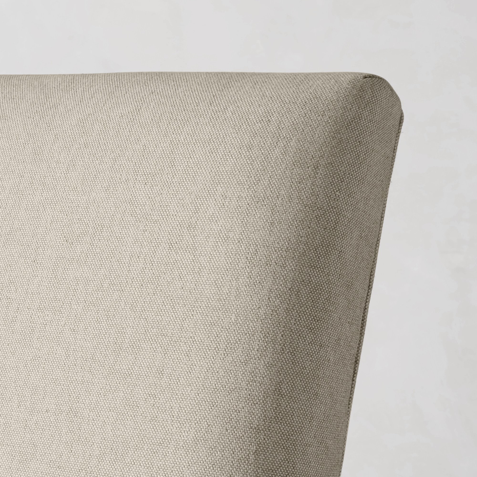 Close-up of chair leg in black finish