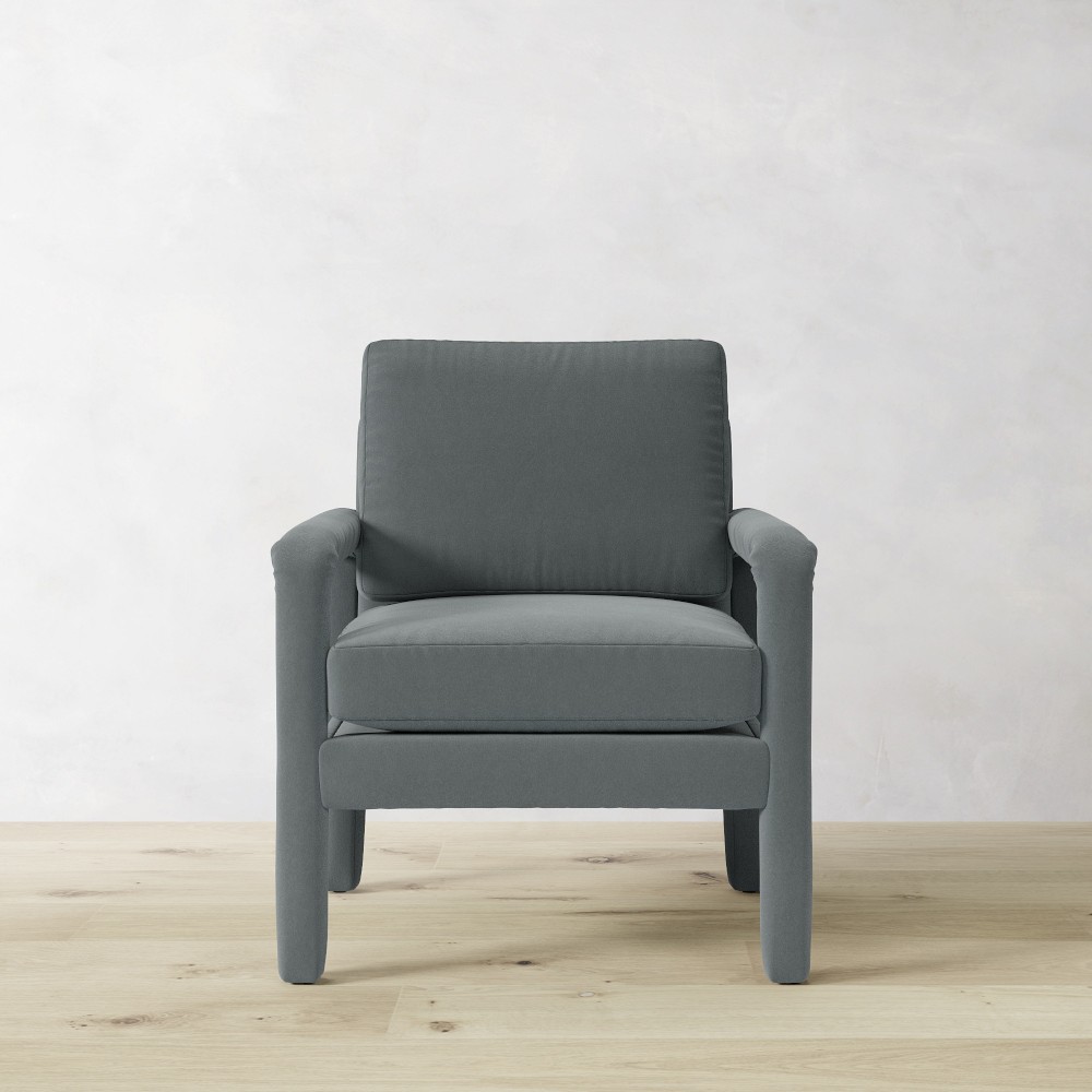 Grey upholstered single chair close-up