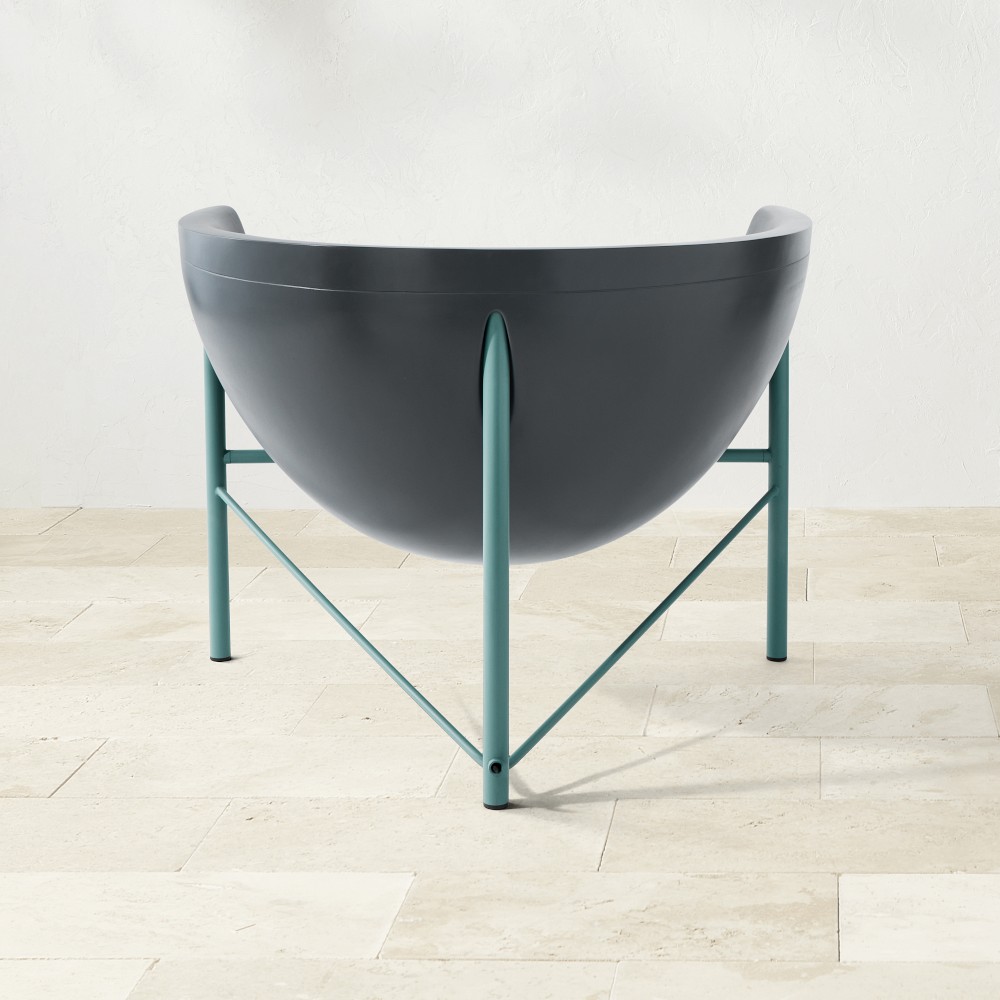 Front view of Kosmos chair showing teal frame and cross-brace