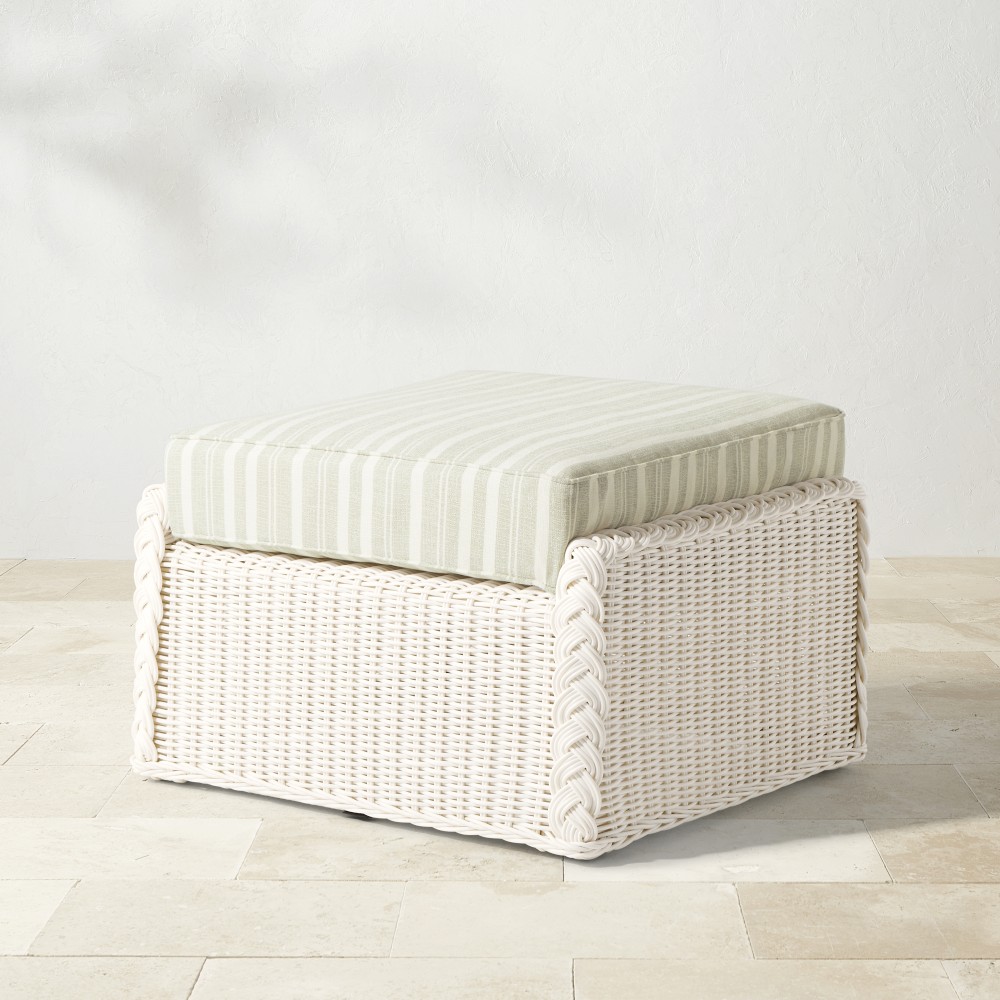 Rectangular white wicker ottoman with striped cushion