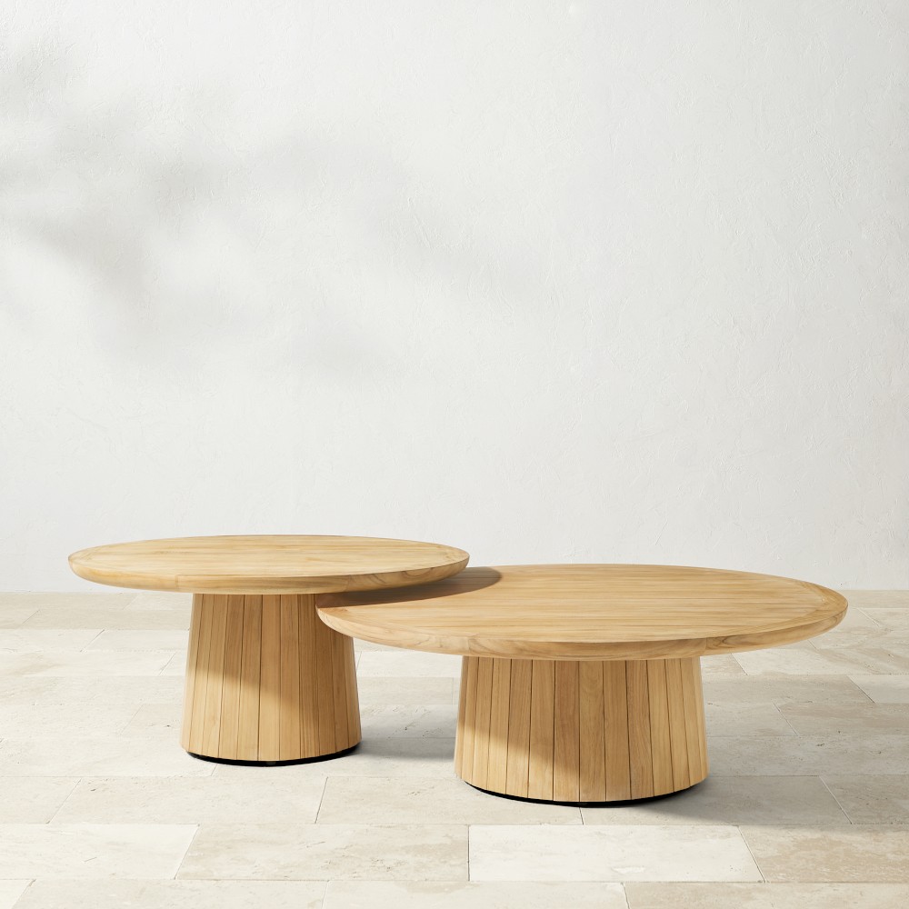 Two round nesting coffee tables shown side by side