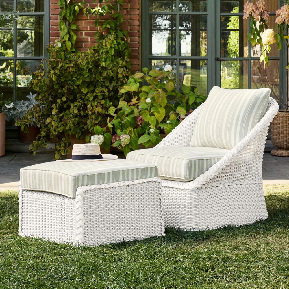 Outdoor seating with striped cushions and planters