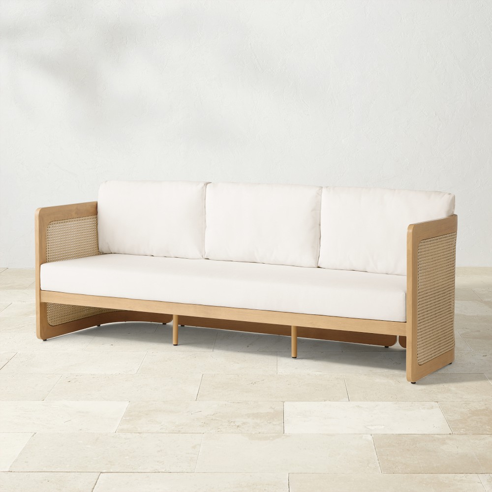 Side view of Capitola outdoor sofa showing perforated sides and base