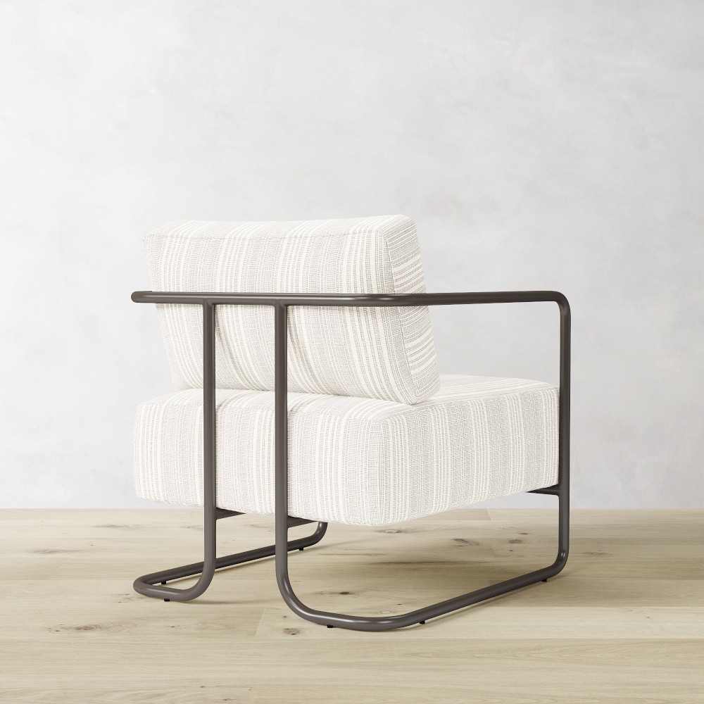 Rear side view of chair showing continuous frame and cushion
