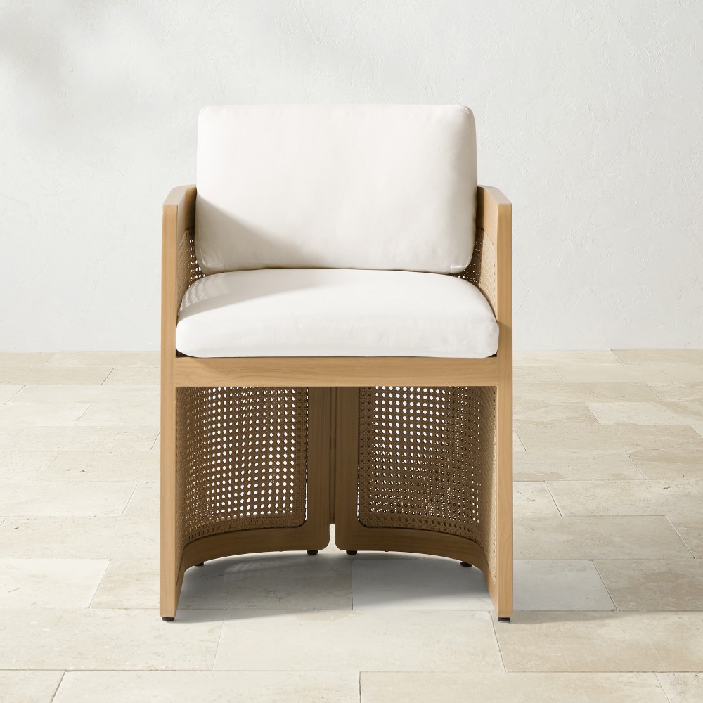 Single outdoor armchair with white cushion in bright studio